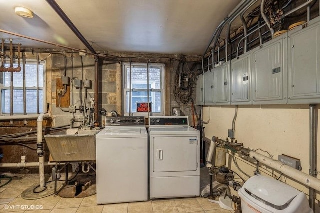 2642 N Harlem Ave Unit Gw, Elmwood Park, IL 60707 - laundry area featuring washer and dryer, light tile patterned floors, healthy amount of natural light, and cabinet space