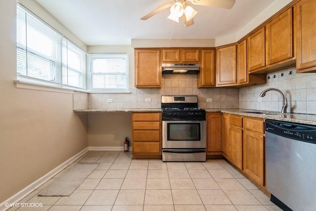 2642 N Harlem Ave Unit Gw, Elmwood Park, IL 60707 - kitchen featuring stainless steel appliances, under cabinet range hood, brown cabinets, and backsplash