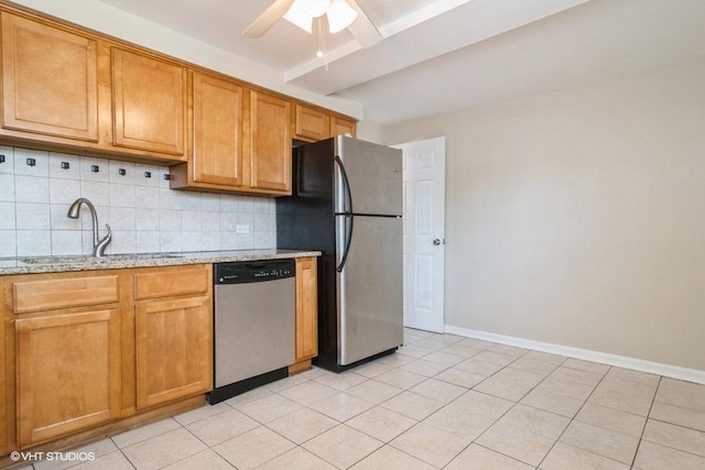 2642 N Harlem Ave Unit Gw, Elmwood Park, IL 60707 - kitchen with appliances with stainless steel finishes, a sink, backsplash, light stone counters, and baseboards