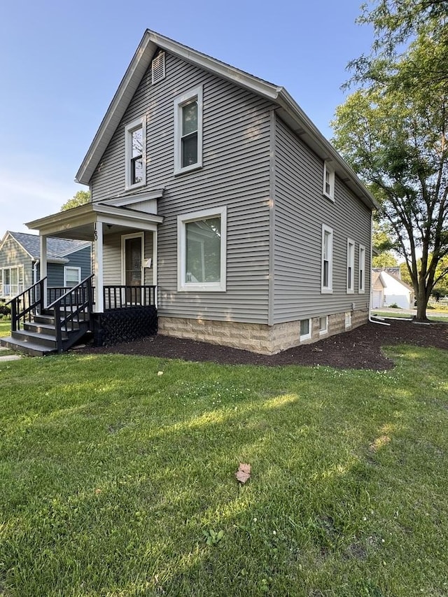 160 S Fordham Ave, Aurora, IL 60506 - view of property exterior featuring a lawn and a porch
