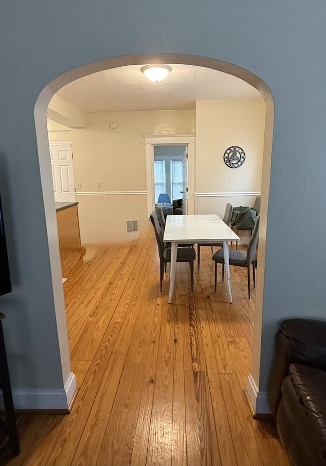 160 S Fordham Ave, Aurora, IL 60506 - dining room with arched walkways and hardwood / wood-style flooring