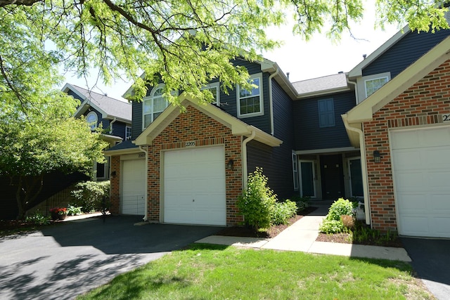 2205 Gladstone Ct, Glendale Heights, IL 60139 - view of front of home with asphalt driveway, brick siding, and an attached garage