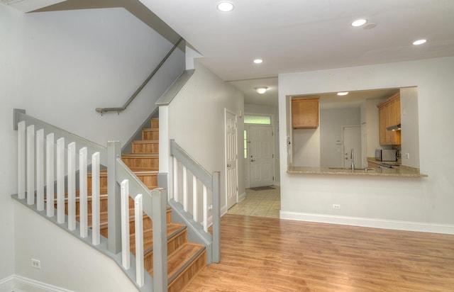 2205 Gladstone Ct, Glendale Heights, IL 60139 - stairs featuring wood finished floors, recessed lighting, and baseboards