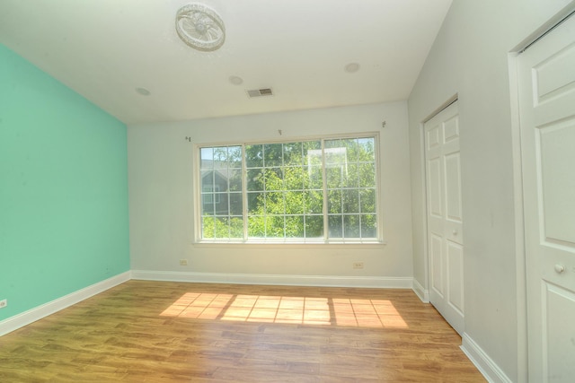 2205 Gladstone Ct, Glendale Heights, IL 60139 - spare room featuring light wood-style floors and baseboards