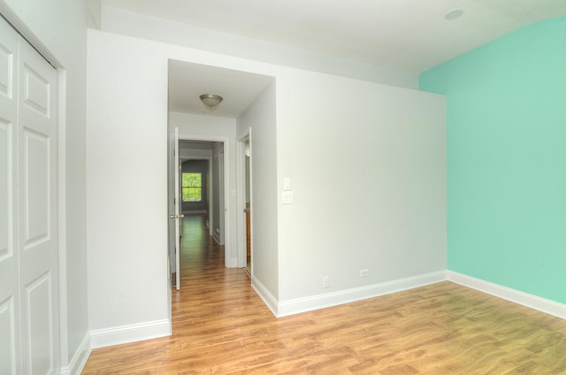 2205 Gladstone Ct, Glendale Heights, IL 60139 - spare room with light wood-style flooring and baseboards