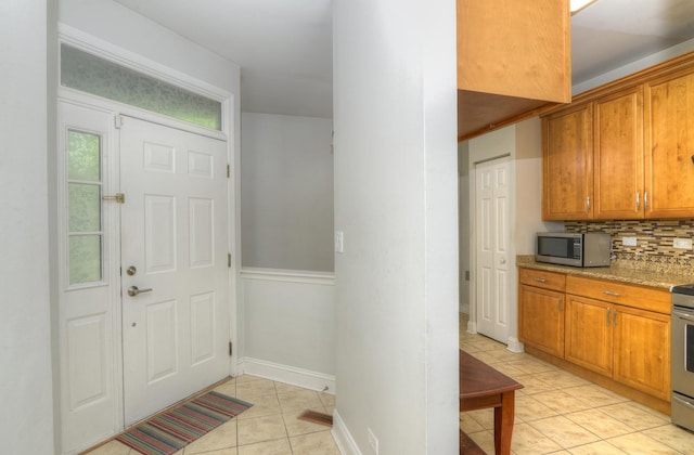 2205 Gladstone Ct, Glendale Heights, IL 60139 - entryway with light tile patterned floors and baseboards