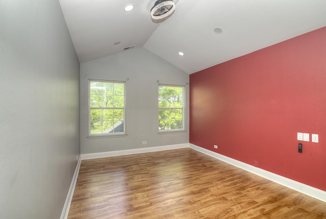 2205 Gladstone Ct, Glendale Heights, IL 60139 - empty room featuring lofted ceiling, wood finished floors, baseboards, and recessed lighting