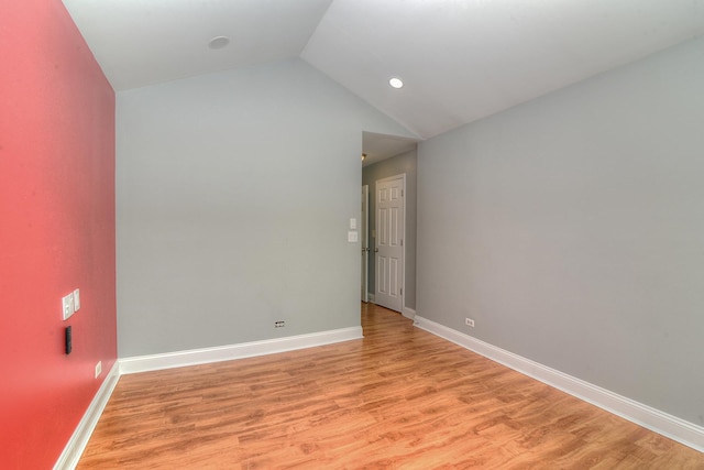 2205 Gladstone Ct, Glendale Heights, IL 60139 - unfurnished room featuring light wood finished floors, vaulted ceiling, and baseboards