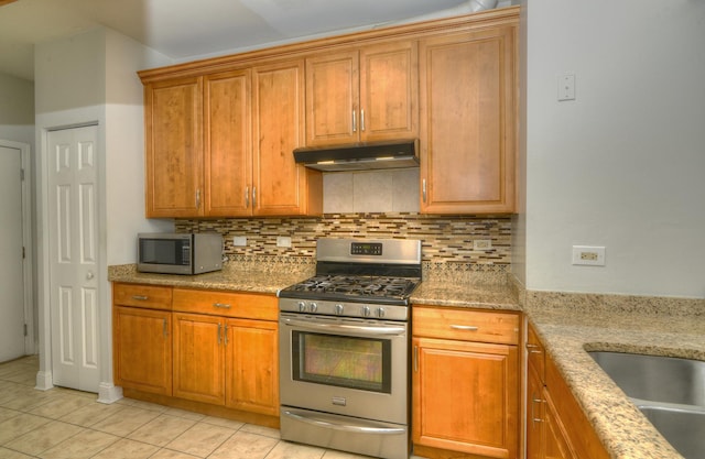 2205 Gladstone Ct, Glendale Heights, IL 60139 - kitchen featuring stainless steel appliances, under cabinet range hood, backsplash, and light tile patterned floors