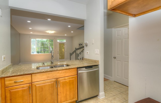 2205 Gladstone Ct, Glendale Heights, IL 60139 - kitchen with stainless steel dishwasher, a sink, light stone counters, light tile patterned floors, and recessed lighting