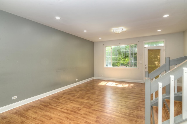 2205 Gladstone Ct, Glendale Heights, IL 60139 - unfurnished room with baseboards, light wood-style floors, recessed lighting, and stairs