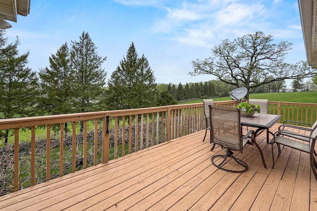 wooden terrace with outdoor dining area