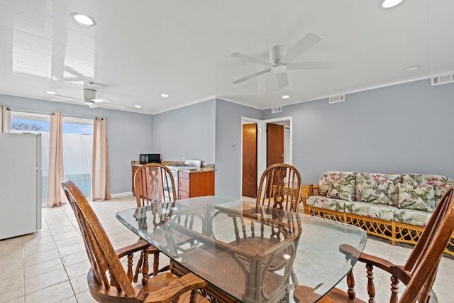 dining area featuring a ceiling fan, recessed lighting, ornamental molding, baseboards, and light tile patterned floors