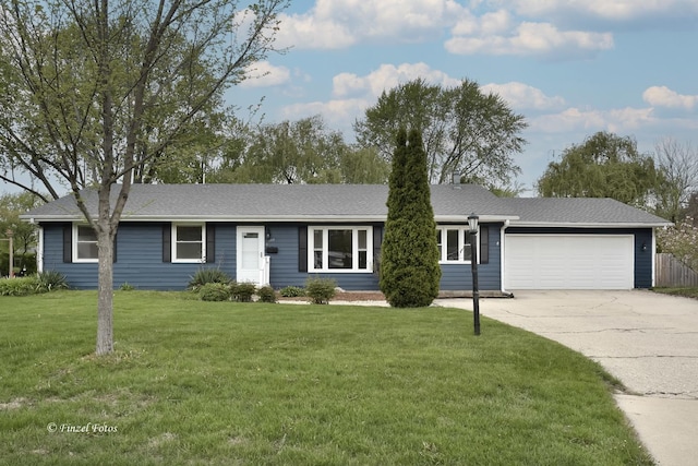 193 Thunderbird Trl, Carol Stream, IL 60188 - single story home featuring concrete driveway, a front yard, roof with shingles, and a garage