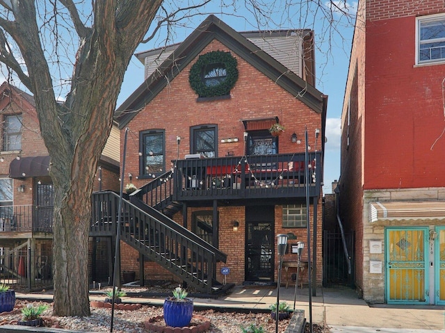 708 N Rockwell St, Chicago, IL 60612 - back of property with brick siding, a deck, and stairs