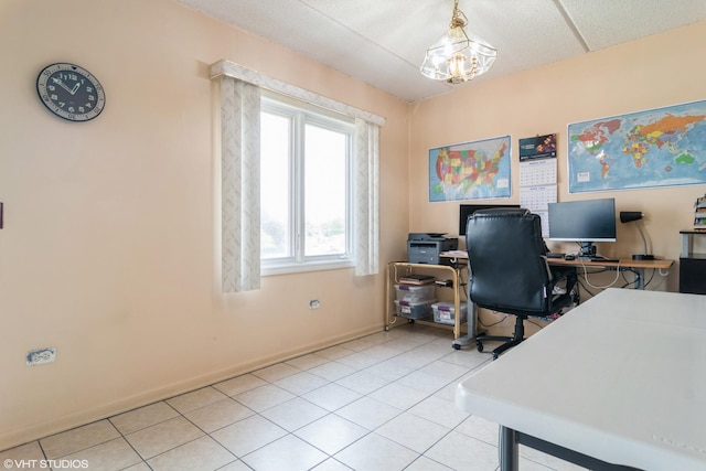 4534 N Cumberland Ave Unit 207, Chicago, IL 60656 - home office with baseboards, light tile patterned flooring, and a chandelier
