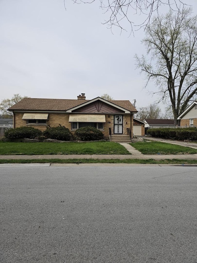 656 E 160th Pl, South Holland, IL 60473 - view of front facade with a garage, driveway, and a front yard