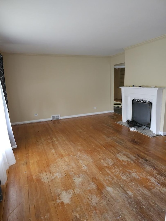 656 E 160th Pl, South Holland, IL 60473 - unfurnished living room featuring light wood-style floors, visible vents, baseboards, and a fireplace