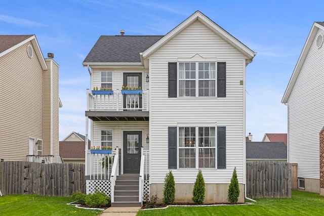 711 W Benham St, Kirkland, IL 60146 - view of front facade with a balcony and roof with shingles