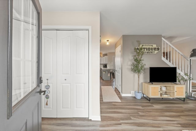 711 W Benham St, Kirkland, IL 60146 - foyer entrance with stairway and light wood-style flooring