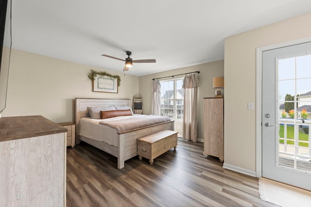 711 W Benham St, Kirkland, IL 60146 - bedroom with access to exterior, dark wood-style flooring, and a ceiling fan