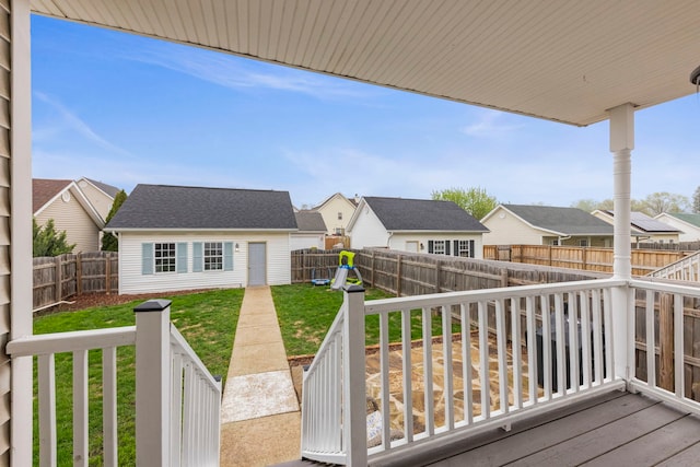 711 W Benham St, Kirkland, IL 60146 - wooden terrace with a residential view, a fenced backyard, and an outbuilding