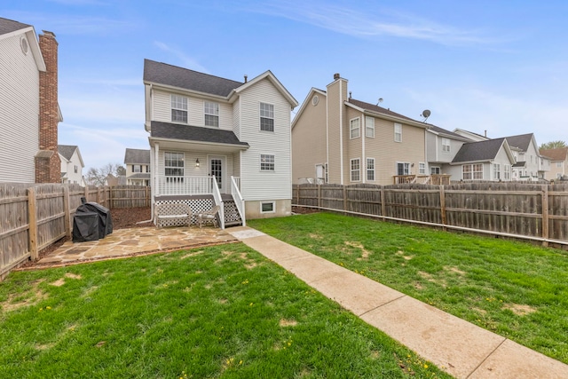 711 W Benham St, Kirkland, IL 60146 - back of house with a fenced backyard, a patio, and a residential view