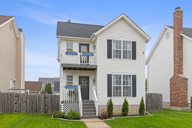711 W Benham St, Kirkland, IL 60146 - traditional-style home featuring a balcony and roof with shingles