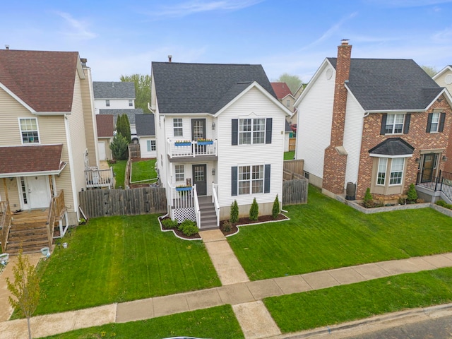 711 W Benham St, Kirkland, IL 60146 - view of front of house featuring a balcony and roof with shingles