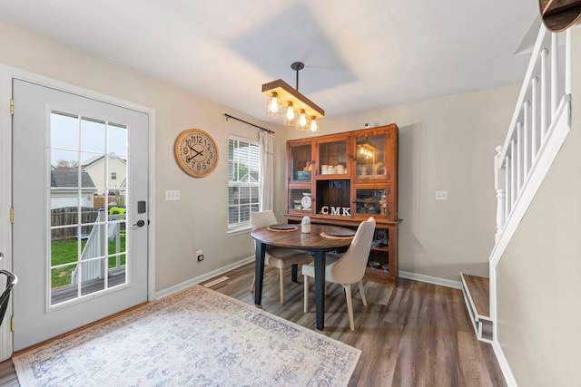 711 W Benham St, Kirkland, IL 60146 - dining area with wood finished floors and a chandelier