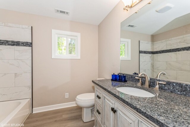 34327 S Lakeside Ter, Wilmington, IL 60481 - bathroom featuring visible vents, baseboards, wood finished floors, and vanity
