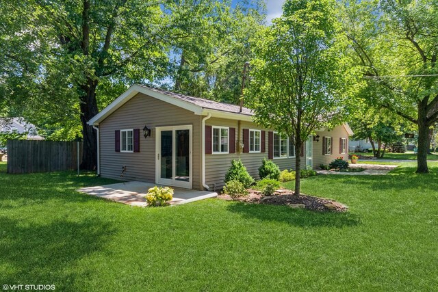 34327 S Lakeside Ter, Wilmington, IL 60481 - rear view of property featuring a patio area, fence, and a yard