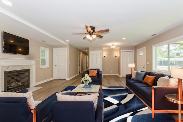 34327 S Lakeside Ter, Wilmington, IL 60481 - living room with recessed lighting, a ceiling fan, wood finished floors, and a fireplace