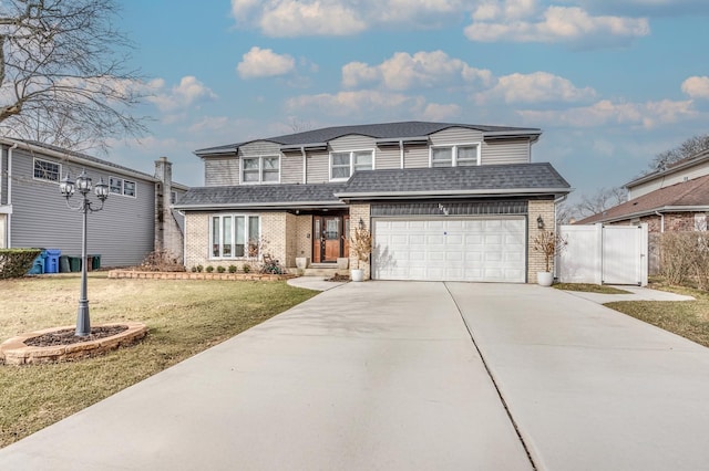 1716 N Beech Rd, Mount Prospect, IL 60056 - view of front facade featuring a garage, a front lawn, fence, brick siding, and concrete driveway