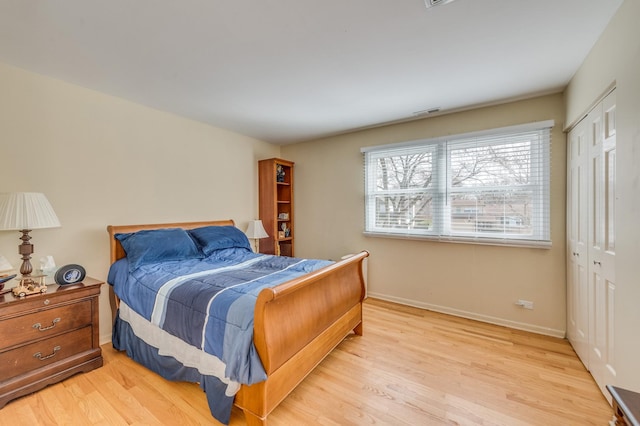 1716 N Beech Rd, Mount Prospect, IL 60056 - bedroom with baseboards, light wood-style flooring, visible vents, and a closet