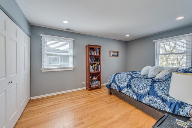 1716 N Beech Rd, Mount Prospect, IL 60056 - bedroom featuring visible vents, baseboards, a closet, light wood finished floors, and recessed lighting