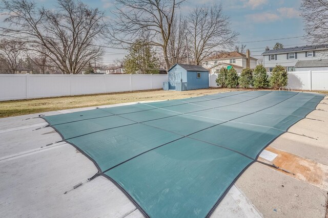 1716 N Beech Rd, Mount Prospect, IL 60056 - view of swimming pool with a storage shed, a fenced in pool, an outdoor structure, and a fenced backyard