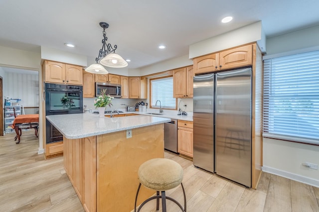 1716 N Beech Rd, Mount Prospect, IL 60056 - kitchen with appliances with stainless steel finishes, light brown cabinetry, a center island, a sink, and light wood-style floors