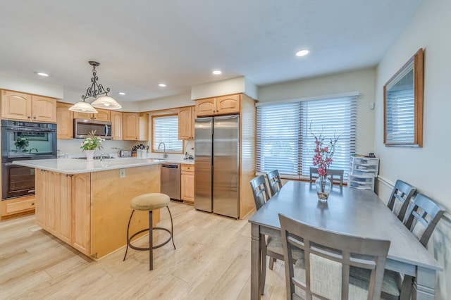 1716 N Beech Rd, Mount Prospect, IL 60056 - kitchen featuring light countertops, appliances with stainless steel finishes, light brown cabinets, and light wood-style flooring