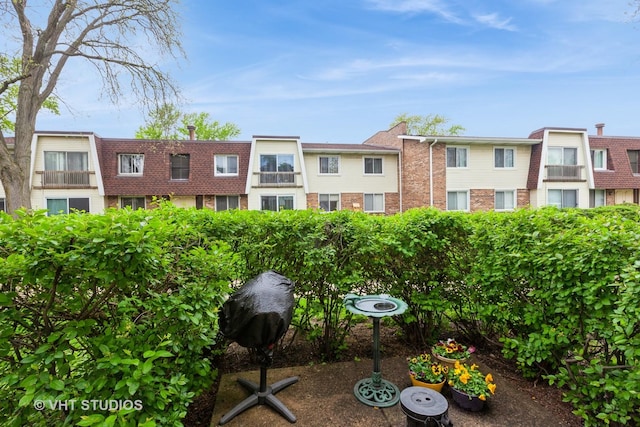 3026 Roberts Dr Unit 4, Woodridge, IL 60517 - townhome / multi-family property with a front lawn, brick siding, and roof with shingles