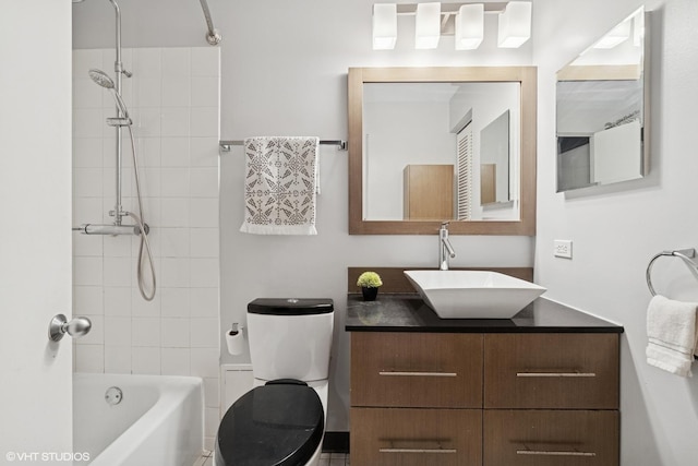 full bath with vanity, toilet, and  shower combination