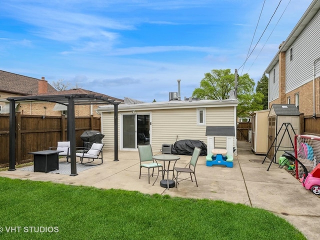 3004 N Olcott Ave, Chicago, IL 60707 - back of house featuring a pergola, a storage shed, a fire pit, a patio, and an outbuilding
