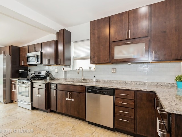 3004 N Olcott Ave, Chicago, IL 60707 - kitchen featuring appliances with stainless steel finishes, a sink, decorative backsplash, dark brown cabinetry, and lofted ceiling