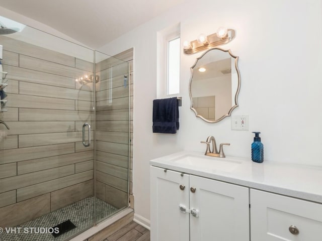 3004 N Olcott Ave, Chicago, IL 60707 - bathroom with a stall shower, vanity, wood finished floors, and lofted ceiling