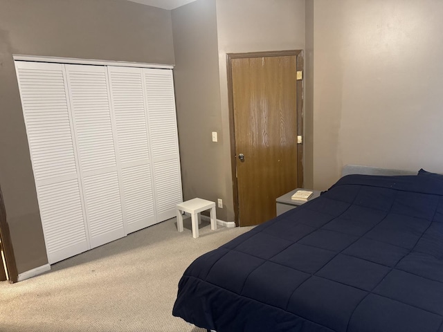 carpeted bedroom featuring a closet