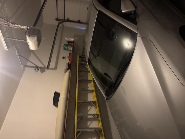 garage with a garage door opener and washer / dryer