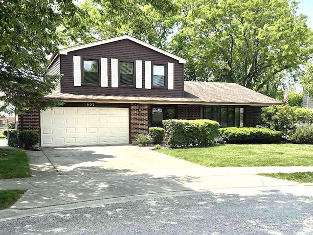 1602 S Surrey Ln, Arlington Heights, IL 60005 - view of front facade with driveway, a garage, a front lawn, and brick siding
