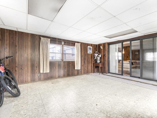 1602 S Surrey Ln, Arlington Heights, IL 60005 - spare room with tile patterned floors, a drop ceiling, and wood walls