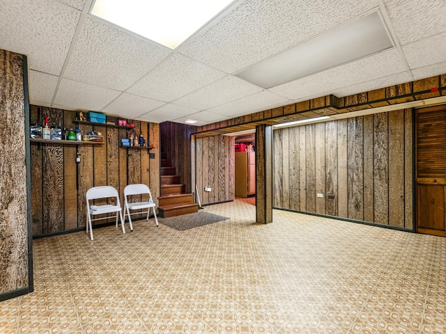 1602 S Surrey Ln, Arlington Heights, IL 60005 - finished basement with stairway, freestanding refrigerator, a drop ceiling, and wood walls