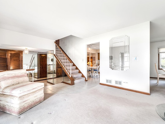 1602 S Surrey Ln, Arlington Heights, IL 60005 - unfurnished living room featuring stairs, carpet floors, baseboards, and tile patterned flooring